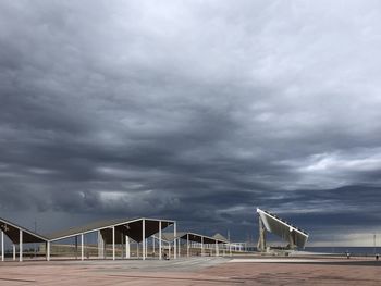 Scenic view of bridge against cloudy sky