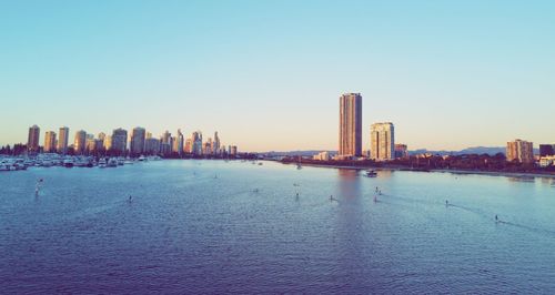 Panoramic view of sea and buildings against clear sky