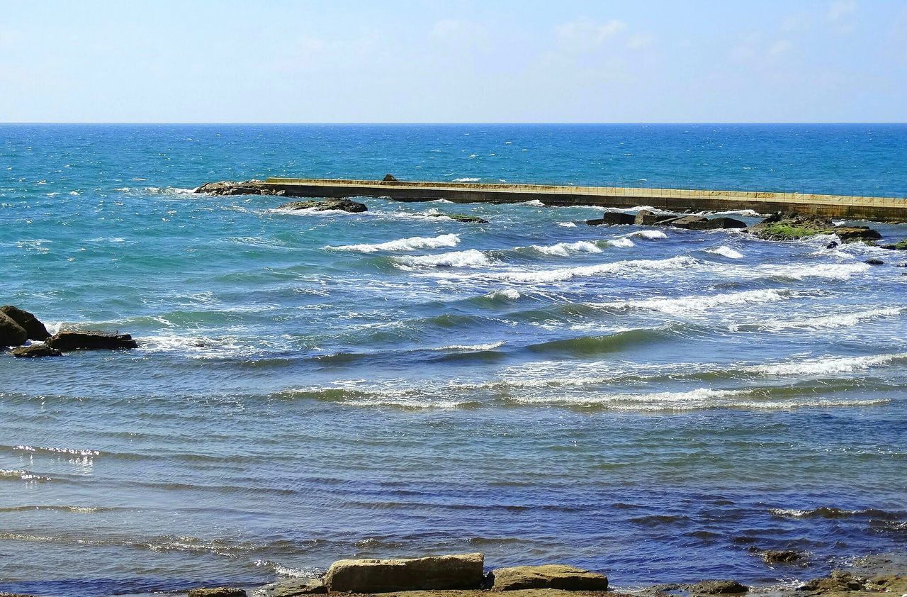 sea, horizon over water, water, scenics, tranquil scene, clear sky, beach, tranquility, beauty in nature, nature, blue, shore, wave, sky, idyllic, seascape, rock - object, copy space, remote, day