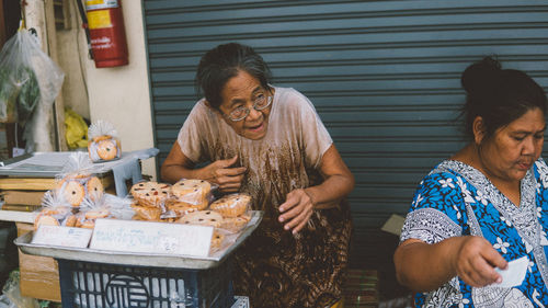 Group of people having food outdoors