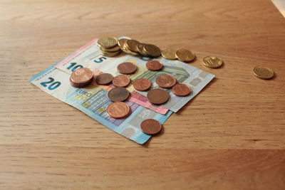 High angle view of coins on table