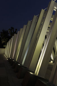 Low angle view of illuminated buildings against clear sky