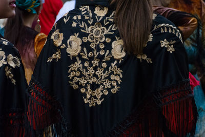 Rear view of woman wearing traditional clothing in city