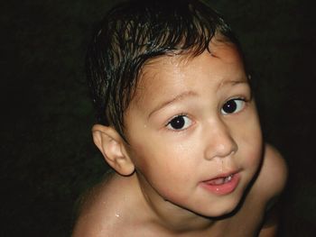 Close-up portrait of shirtless boy