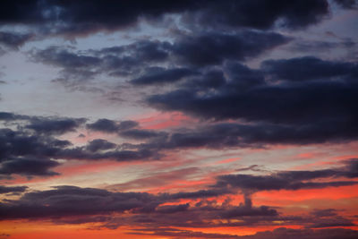 Low angle view of dramatic sky during sunset