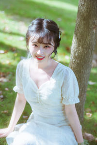 Young woman standing in forest