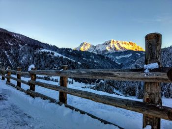 Scenic view of snowcapped mountains against clear sky