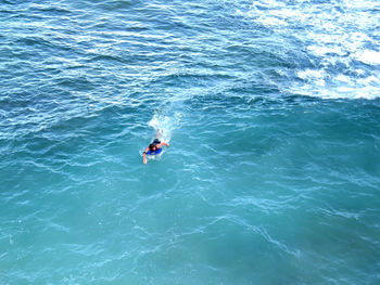 High angle view of man surfing in sea