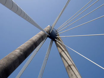 Low angle view of crane against blue sky