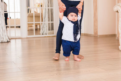 Full length of cute baby boy on floor