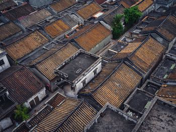 High angle view of roof and houses in city