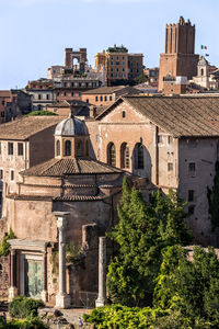 Buildings in city against sky