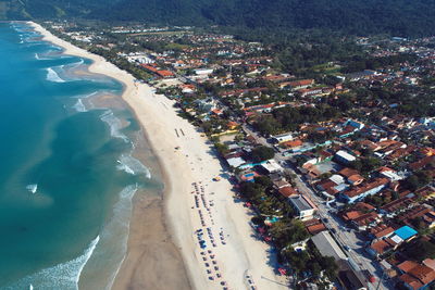 High angle view of sea and buildings in city