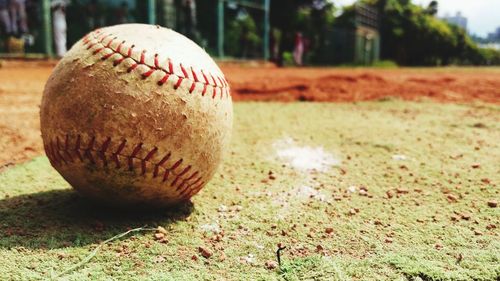 Close-up of baseball on field