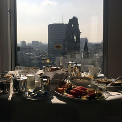 High angle view of food on table against window in city