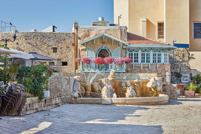 Central square of old jaffa with fountain of zodiac signs, restaurants 
