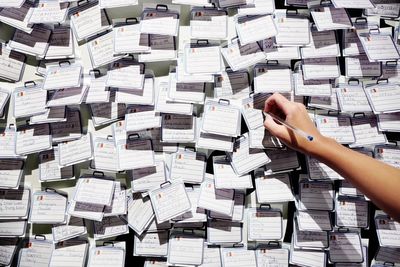 Cropped image of hand holding book