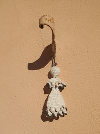Close-up of toy hanging on wall
