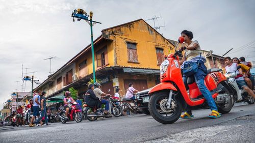 People riding bicycles on road