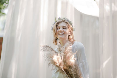 Portrait of a smiling young woman outdoors