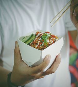 Close-up of person holding food