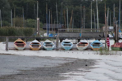 Boats moored on shore