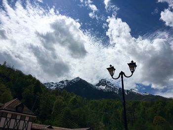 Scenic view of mountains against cloudy sky