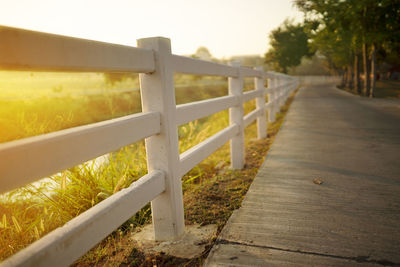 White concrete fence with path way