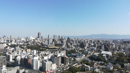 High angle view of buildings against clear sky