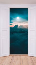 Scenic view of blue sky seen through open door