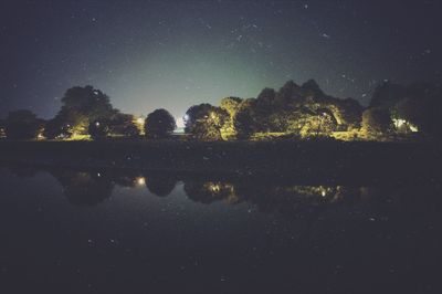 Scenic view of landscape against sky at night