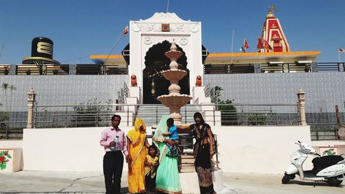 Statue outside temple against building