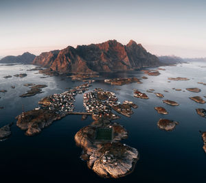 Scenic view of sea and mountains against sky