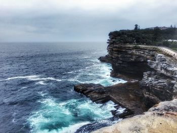 Scenic view of sea against cloudy sky