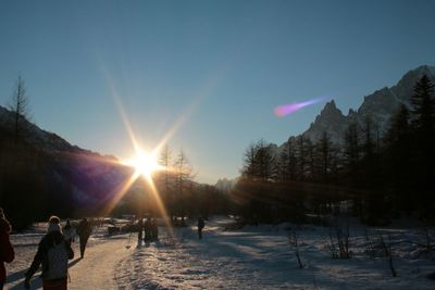 Scenic view of snow covered landscape against sky