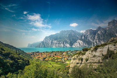 Panoramic view of field and mountains against sky