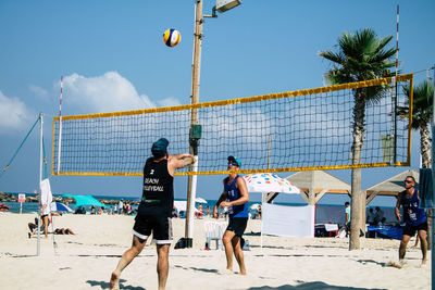 People playing on beach