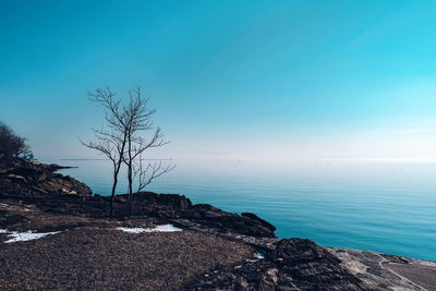 Scenic view of sea against blue sky