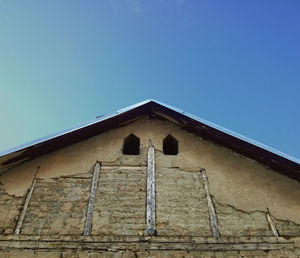 Low angle view of building against blue sky