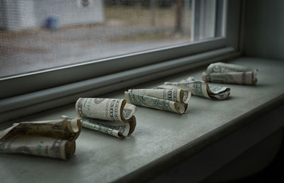 Close-up of objects on window sill