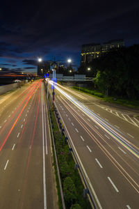 High angle view of light trails on road at night