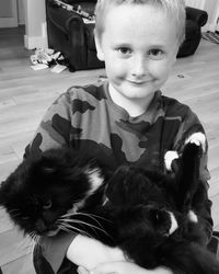 Portrait of boy with cat