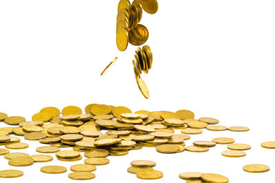 Close-up of coins on white background