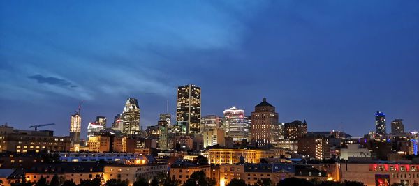 Illuminated buildings in city at night