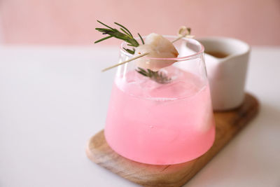 Close-up of pink cherry on table