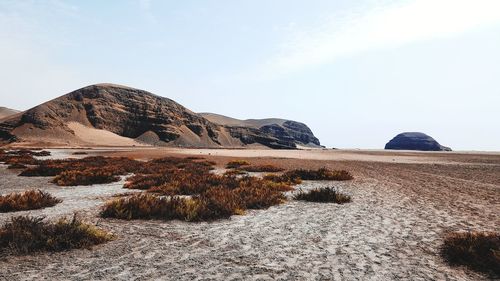 Rock formations on landscape against sky