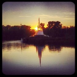 Scenic view of lake at sunset