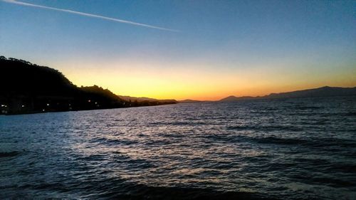 Scenic view of sea against sky at sunset