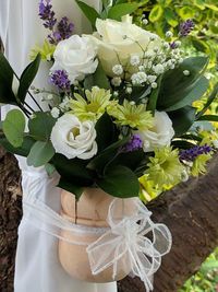 Close-up of white roses in vase