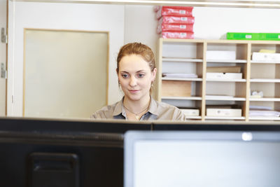 Young woman working in office